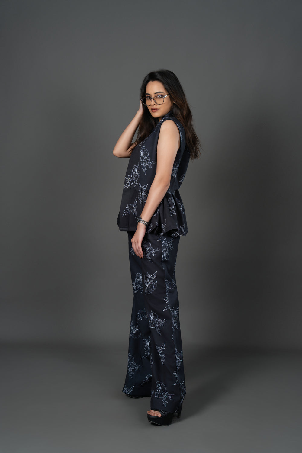 Woman wearing a dark floral outfit